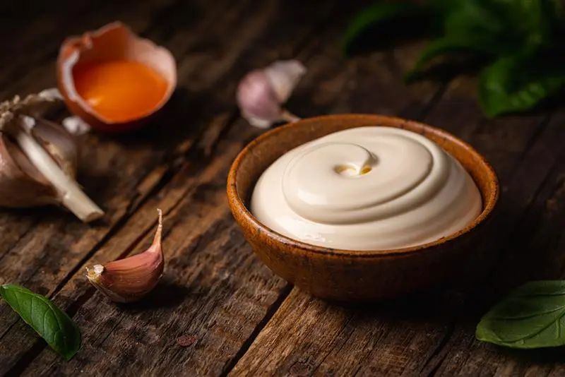 A smooth, freshly made garlic mayonnaise a perfect example for anyone wondering How Can I Make Mayonnaise at home.